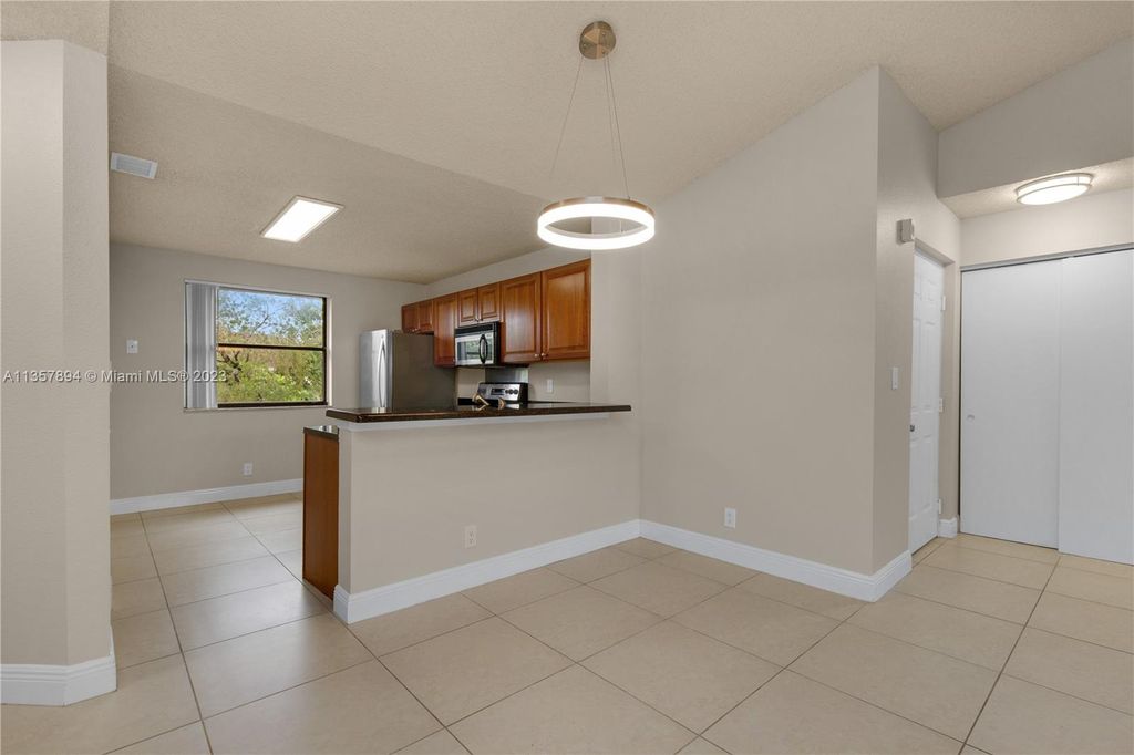 Photo of 10105 W Sunrise Blvd #306, Plantation, FL 33322 (MLS # A11357894)