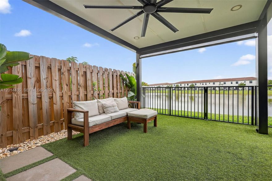 ASSUMABLE MORTGAGE OF 4.2% AVAILABLE. Welcome home to this beautiful turnkey townhouse built by Lennar in 2024 with amazing lake views. This residence features 3 beds/2.5 baths/1 car garage and over 1,500 sq ft, a fenced backyard with artificial turf and decorative plants & rocks, a newly installed pergola with ceiling fan & lighting. Quartz countertops, modern backsplash and ss appliances in the kitchen. The spacious primary ensuite with custom closets, and the primary bathroom upgraded with removal of builder-grade mirror, installation of custom individual mirrors & double vanity, 2 additional bedrooms with high ceilings, custom closets, second bathroom with tub/shower combo, vinyl flooring throughout the home, updated light fixtures,ceiling fans, motorized garage door and overhead ceiling storage racks in the garage, 2024 AC and water heater, black out blinds, new washer & dryer, custom fixtures in the powder room, all impact windows and doors. Custom Gym installed in the garage. Entry covered porch area and 2 parking spaces in the driveway, plus additional parking across the street, only available in this section. Westview offers residents amenities like a resort style pool, fitness center, kids play area, dog park, clubhouse, 24hr guarded entrance area. Located within minutes of Downtown Miami, Miami Beach, Miami Int' Airport, major highways, restaurants, shopping. Perfect for first time home buyers, second home, or great potential rental income.