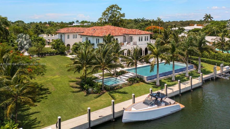Spacious and spectacularly designed 18,045 Sq. Ft. residence with 223 Ft of water frontage and state-of-the-art amenities in Gables Estates.  Nine bedrooms, nine full bathrooms, two half bathrooms, and luxurious main suite with a balcony, gorgeous spa-like dual baths and walk-in closets.  A grand hallway leads to the beautiful living room, formal dining room, great room, and chef's kitchen with a spacious center island and Miele, Wolf and SubZero appliances. The expansive terrace has lounging and dining areas, outdoor kitchen and an infinity-edge pool and spa that cascades to manicured landscaping. Highlights include a private dock, gym, office, media room, elevator, 4-car garage, playground, and staff quarters. Unique design features and finishes for a resort-like lifestyle.