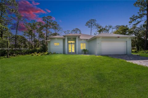 Photo of 1912 Roosevelt Ave, Lehigh Acres, FL 33972 (MLS # A11929547)