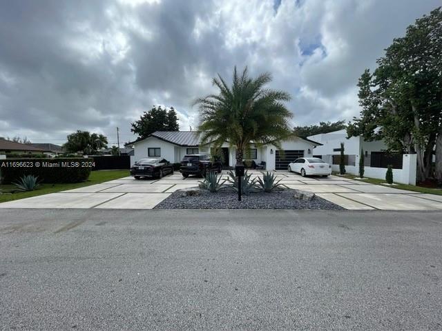 A must see home NO HOA!!! Beautiful and completely updated, new kitchen, new bathroom, new flooring and 2 year aluminum roof, this property features an open layout, updated pool, full pool bathroom, pool house and an state of the art exterior kitchen to gather with friends and family. This property has an open front driveway and backyard with built-in concrete slabs and synthetic grass, the property is close to class A and charter schools, close to expressways, 5 minutes from downtown Doral, Doral City Centre and 10 minutes from Dolphin Mall and Miami Airport, easy to show with appointments!!!!