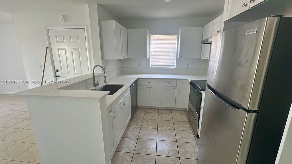 Photo of 4096 N Pine Island Rd #2112, Sunrise, FL 33351 (MLS # A12083359)