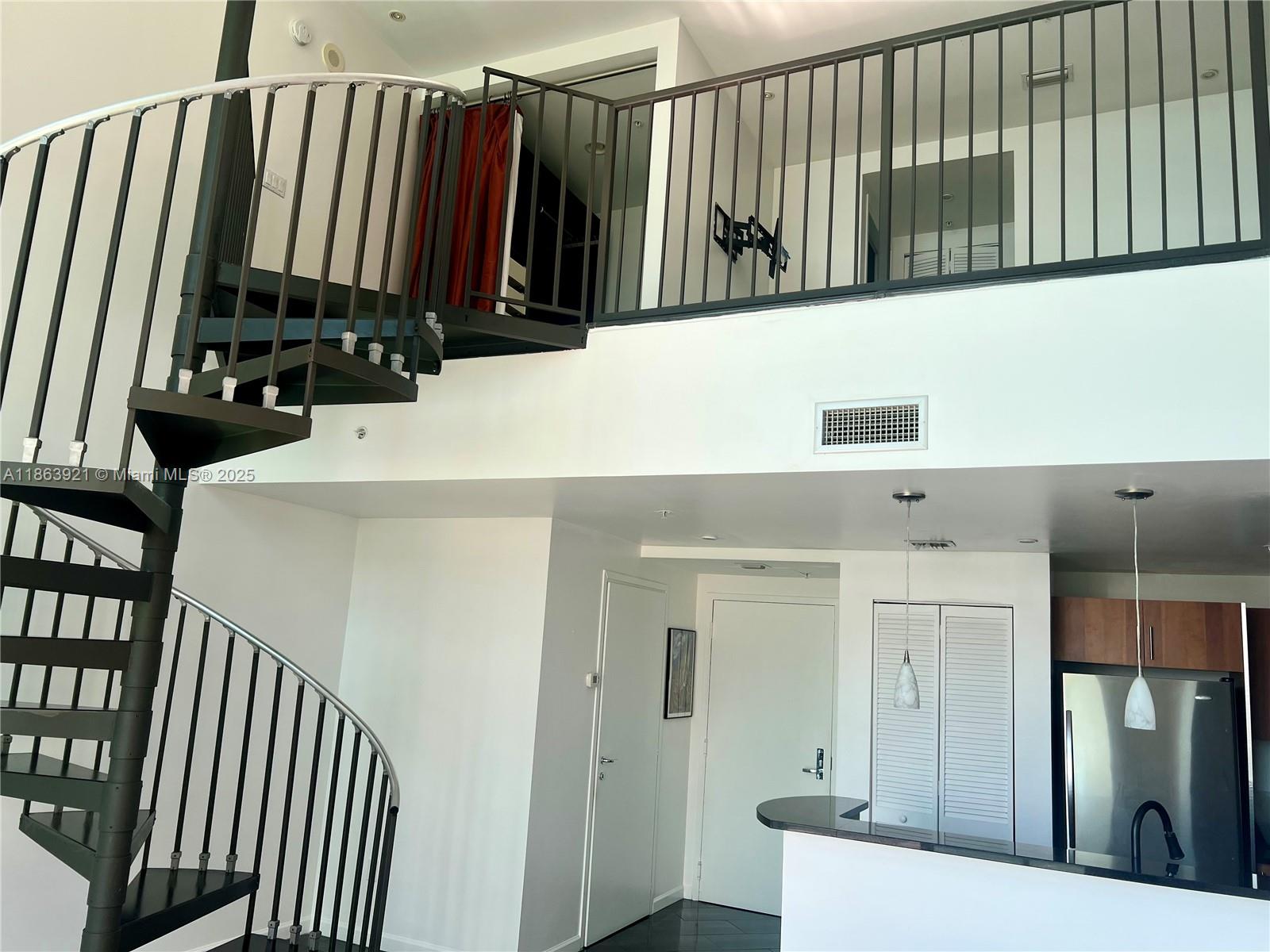 Amazing bay views from this 2-story Loft with East exposure. This one-of-a-kind unit offers 19'4" high ceilings, tile floors throughout, floor to ceiling electric shades, custom made closets, upgraded bathrooms. Den upstairs converted to a closet for additional storage space. One assigned parking space on the same floor! Gym is getting brand new LifeFitness equipment. Steps to Aston Martin bay walk, Whole Foods Market, Bayfront Park, Novikov Restaurant, Joe & the Juice, Gordon Ramsay Hell's Kitchen among many others plus 17 screens' Silverspot Cinema. Minutes from Brickell City Center, Kaseya Arena & Arsht Center for the Performing Arts. Chic downtown living at its best! Pool is closed undergoing construction.