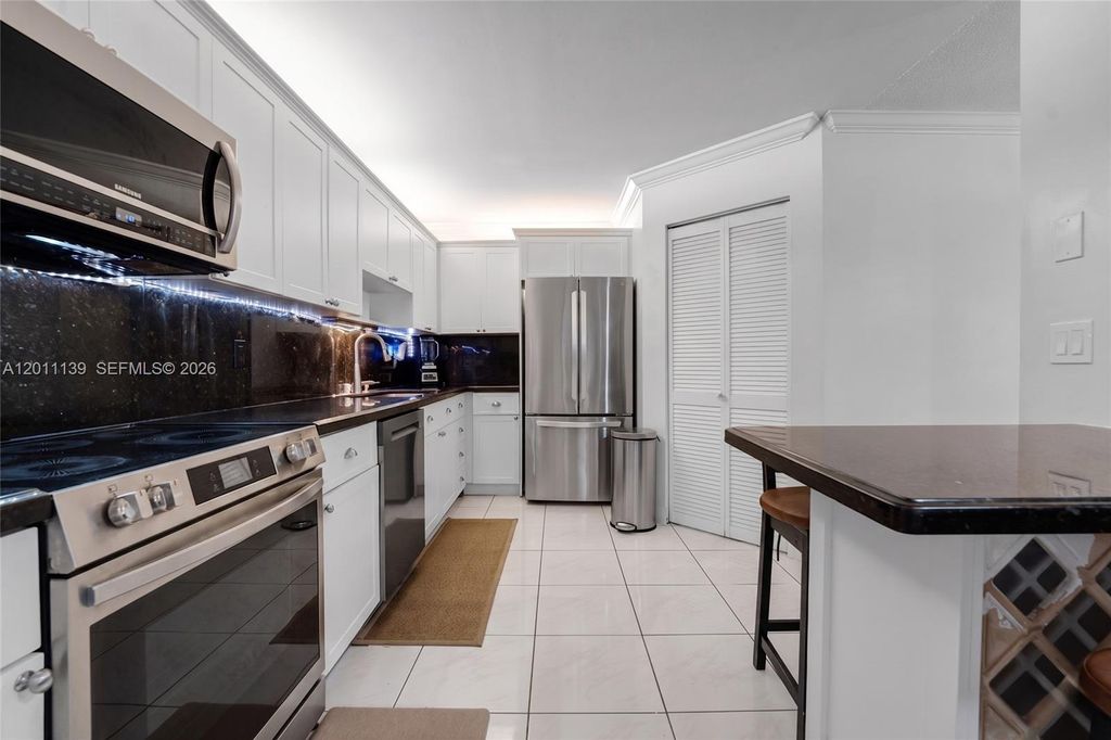 Photo of 595 Racquet Club Rd #74-19, Weston, FL 33326 (MLS # A12011139)