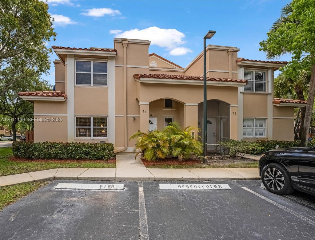 Photo of 595 Racquet Club Rd #74-19, Weston, FL 33326 (MLS # A12011139)