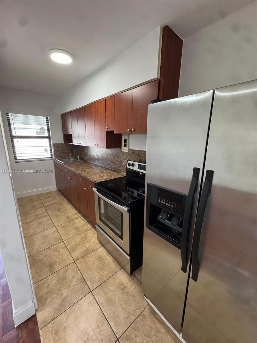Beautifully updated 1 bed / 1 bath featuring a spacious living & dining area, a sleek kitchen with stainless steel appliances, and new impact windows. Includes two new A/C units, ample closet space, assigned parking, and access to washer & dryer in the building. Freshly painted and move-in ready. Great location near Biscayne Blvd with easy access to I-95 and major roads. Water included. Bright unit with a lovely view, a great place to call home.