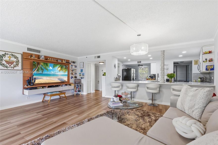 Welcome To This Oversized 2 Bed / 2 Bath Condo With Open Floor Plan Located In The Prestigious Palm Aire Country Club. This Move-In-Ready Unit Boasts A Spacious Open Floor Plan Featuring Luxury Vinyl Flooring And Elegant Plantation Shutters Throughout. The Large Eat-in Kitchen Is A Chef's Dream, Complete With White Shaker Cabinets, Quartz Countertops, Stainless Steel Appliances, And Abundant Storage. Relax And Enjoy On The Large Screened-in Patio With A Panoramic Views Of The Manicured Golf Course. Primary Suite Features A Ceiling Fan, Golf Views, And An Upgraded Bath With A Smart Mirror And Quartz Vanity. Enjoy The Convenience Of A Full-size In-unit Washer/dryer And A Separate Storage Unit. Peace Of Mind Comes Standard With A Brand New Roof (2025), Newer AC (2022), And A Well-maintained Building That Has Completed Its 40-year Inspection With Reserves. HOA Fee Is All-inclusive Of Cable, Internet, Water, Sewer, Trash, Exterior Insurance, And Roof Maintenance. Located In An All-ages Building With NO Mandatory Golf Membership Fees. Association Requires Minimum 700 Credit Score And 20% Down Payment.