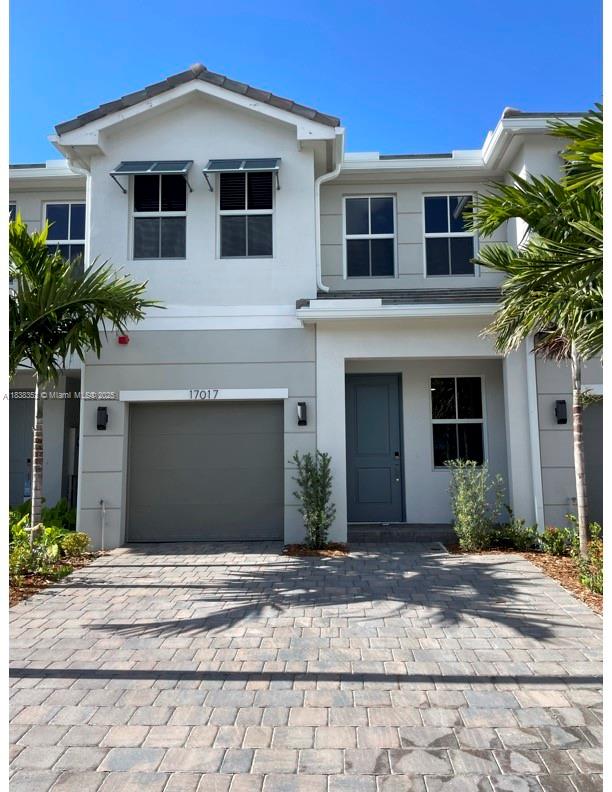 SPECTACULAR BRAND-NEW TOWNHOUSE. 4 BEDROOMS-3 BATH IN THE NEW MERRICK SQUARE COMMUNITY. TILED FIRST FLOOR. KITCHEN WITH STAINLESS STEEL APPLIANCES, QUARTZ COUNTERTOPS, WASHER AND DRYER AND TANKLESS WATER HEATER. FRAMELESS SHOWER IN TWO BATHROOMS. GARAGE FOR 1 CAR AND PARKING FOR 2 MORE VEHICLES IN DRIVEWAY. ONE BEDROOM AND A FULL BATH ON THE FIRST FLOOR. PRIME LOCATION CLOSE TO SHOPPING, RESTAURANTS, COSTCO, SAWGRASS MALL, HOSPITAL, PARKS. COME AND SEE IT TODAY BEFORE IT IS GONE.
