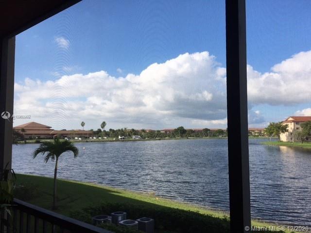 LAKE SIDE, REMODELED 2BR 2BA JASMINE MODEL (SPOTLESS & MOVE IN READY). THE UNIT FEATURES: WOOD FLOORS, WASHER/DRYER, TANK-LESS WATER HEATER, WALK IN CLOSET & SHOWER IN MASTER BEDROOM, ENCLOSED BALCONY WITH SERENE VIEW OF MAIN LAKE. It is Guard Gated & Patrolled. Experience Walking Trails & Outside Greenery, Golf, Tennis, Pools, Fitness Centers, Complimentary Transportation. Next to Pembroke Gardens Shops and Pembroke Lakes Mall. HOPA 55+.