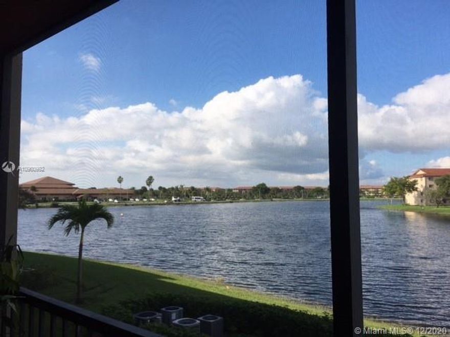 LAKE SIDE, REMODELED 2BR 2BA JASMINE MODEL (SPOTLESS & MOVE IN READY).  THE UNIT FEATURES:  WOOD FLOORS, WASHER/DRYER, TANK-LESS WATER HEATER, WALK IN CLOSET & SHOWER IN MASTER BEDROOM, ENCLOSED BALCONY WITH SERENE VIEW OF MAIN LAKE.  It is Guard Gated & Patrolled. Experience Walking Trails & Outside Greenery, Golf, Tennis, Pools, Fitness Centers, Complimentary Transportation. Next to Pembroke Gardens Shops and Pembroke Lakes Mall. HOPA 55+.