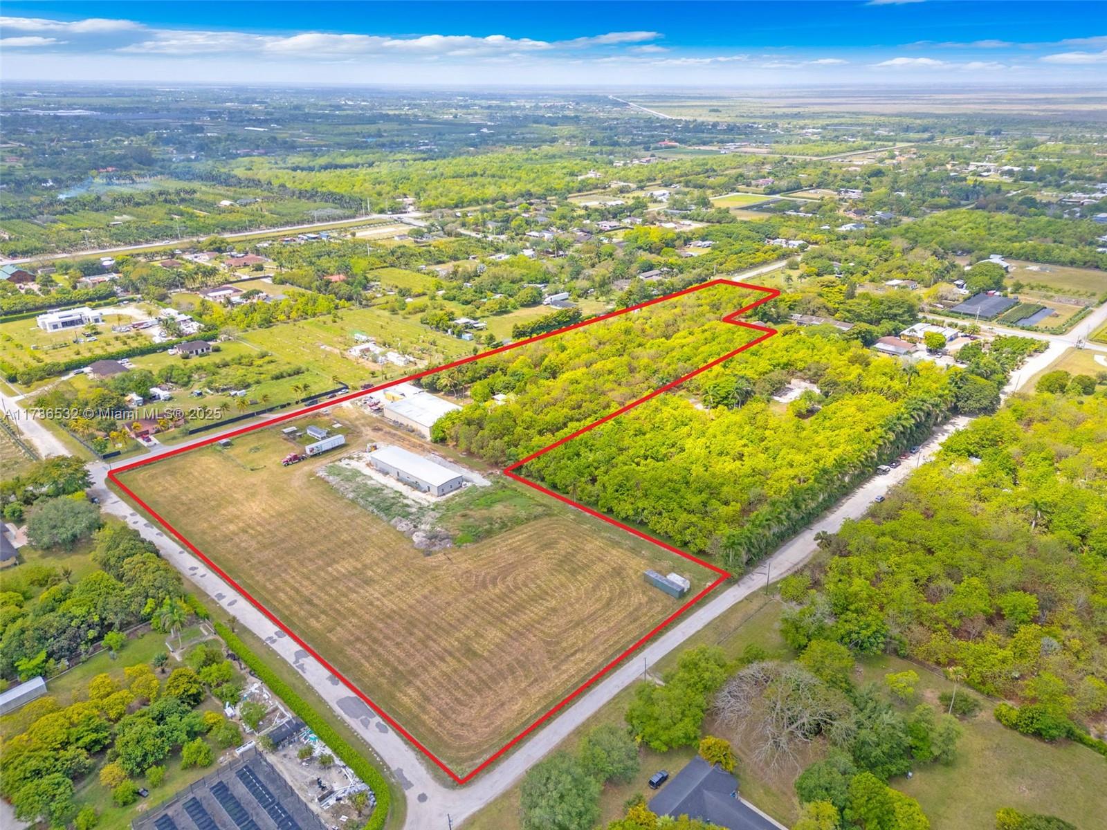 OPTIONS ARE ENDLESS ON THIS 11.71 ACRE AGRICULTURALLY EXEMPT PROPERTY W/ 6.5 ACRES OF INCOME PRODUCING MAMEY (2 VARIETIES) PLANTED ON 20'X30'FOOT CENTERS W/ DIESEL & ELECTRIC PUMPS, AS WELL AS, 2 LARGE OUTBUILDINGS. BUILDING #1, A 7,000 SQUARE FOOT 70'X100' WAREHOUSE, W/ 2 BAY DOORS & A METAL WALL DIVIDES THE SPACE (CAN BE REMOVED TO MAKE 1 LARGE SPACE). BUILDING #2, A BRAND NEW 4,320 SQUARE FOOT 36'x120' WAREHOUSE W/ IMPACT WINDOWS, 2 BAY DOORS, PLUMBED, W/ 2 WALK IN DOORS. BOTH BUILDINGS HAVE 3 PHASE ELECTRIC, 2 METERS ON-SITE, NICE WALK-IN COOLER, A/C OFFICE W/ BATH, SEPTIC & 5 ACRES OF CLEARED LAND. THERES A MONTH-TO-MONTH TENANT ON THE 7,000 SQUARE FOOT BUILDING, HE WOULD LOVE TO CONTINUE TO RENT, IF DESIRED. COMPLETELY CYCLONE FENCED W/ 2 PAVED STREETS THAT BORDER THE PROPERTY.