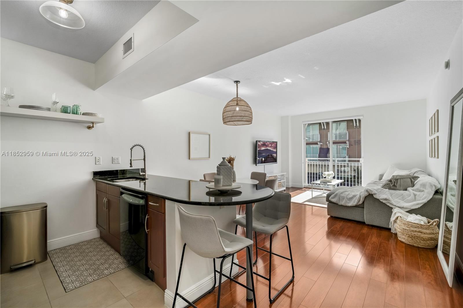 Welcome to this 1 bedroom 1 bath condo unit in Downtown Dadeland. Entering the unit, you are flooded with natural light coming through the impact windows. The kitchen is a culinary delight, with elegant wood cabinets, granite countertops, and stainless steel appliances. You have laminate floors throughout the main living areas. Community amenities include a roof top infinity pool and gym. Walk downstairs to restaurant and bars and you are right across the street from Dadeland Mall. 1 garage parking space with the opportunity to rent an extra space through the association. Call today easy to show!