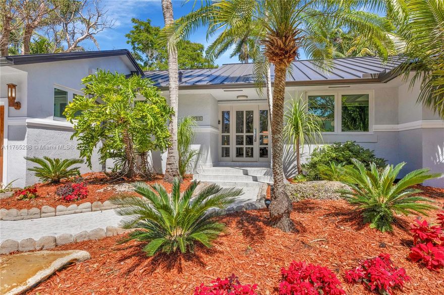 A rare find! This 4-bedroom, 2-bathroom home with a den/office blends comfort, elegance, and modern upgrades. Spanning 2,400+ sq. ft., it features vaulted ceilings, custom closets, wood flooring, and a chef’s kitchen with quartz countertops. A wood-burning fireplace adds charm, while impact windows and doors ensure security. Two A/C systems, a 2024 metal roof, and PVC/copper plumbing enhance efficiency. Palmetto Bay, the "Village of Parks," is known for tree-lined streets, top-rated schools, and abundant green spaces. Enjoy easy access to Biscayne Bay, Deering Estate, and Coral Reef Park. Outdoor living shines with Trex composite deck and hot tub spa, perfect for entertaining. With no HOA and a prime location, this home offers tranquility and convenience.