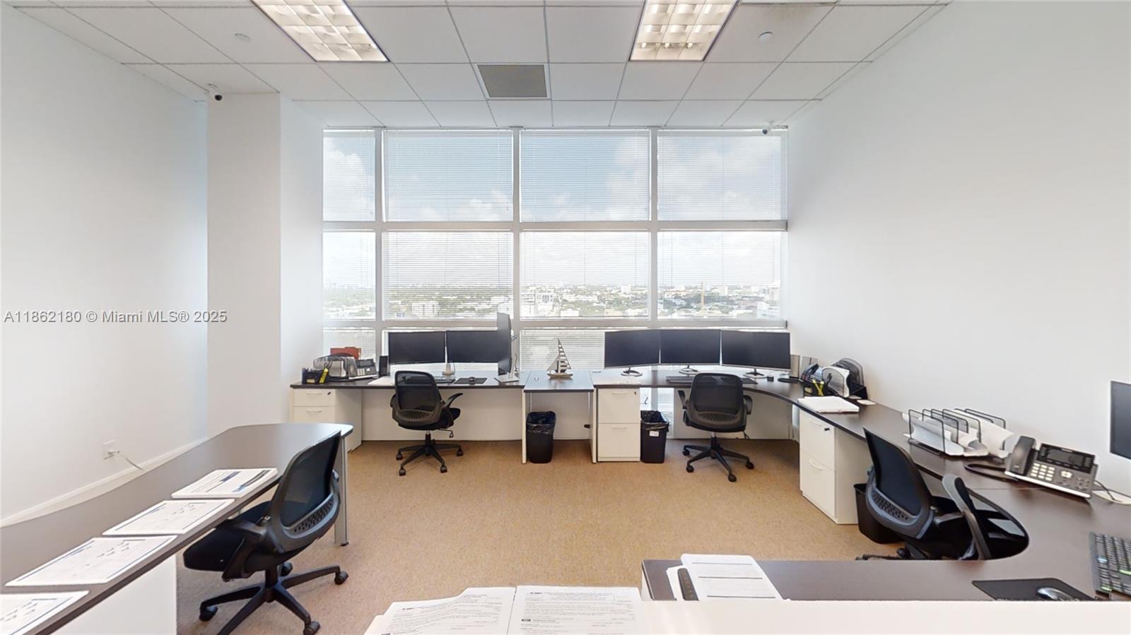 Corner Office Fully furnished 1472 sq ft SHARED SPACE of 2124 sq ft. with only two owner members. Up to 3 separate workstation areas included. One 25' x 12'-foot office area desk, One 20' x 19' Five-person workstation, One 8' x 10' reception desk. Plus, private lobby waiting room receptionist area, large conference room & storage/IT room & filing cabinets a rarely available private kitchen/lunch area. Perfect for professional financial services style office. Excellent location on the Miami Riverwalk path and on-site restaurants for visiting clientele. Guest parking and valet available for monthly rates.