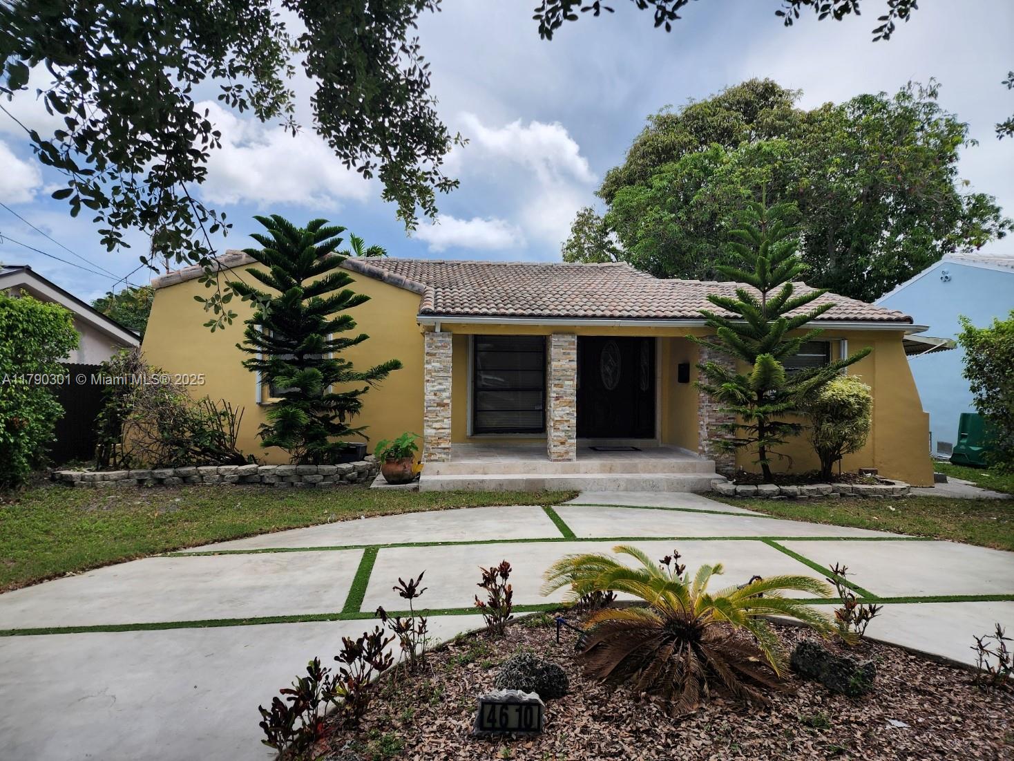Spacious 5BD/3BA home with in-law quarters, zoned for Coral Gables High. 1,932 sq ft house. Previously set up with a private side entrance for in-laws or guests, connected by an interior door for privacy and flexibility. Updated kitchen counter top, appliances, with brand new wood floors, plus wood flooring in the living and dining rooms, and tile in all bedrooms. Potential for a 6th bedroom or office. Outdoor features include a covered patio with ceiling fans, a tiki hut perfect for entertaining, and a detached laundry room with storage. Located on a quiet street with easy access to Coral Gables, major highways, and shopping. Ideal for extended families, rental income, or home office needs. Move-in ready with space to personalize or expand.