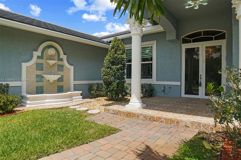 Photo of 5730 NW 66th Way, Parkland, FL 33067 (MLS # A11589851)