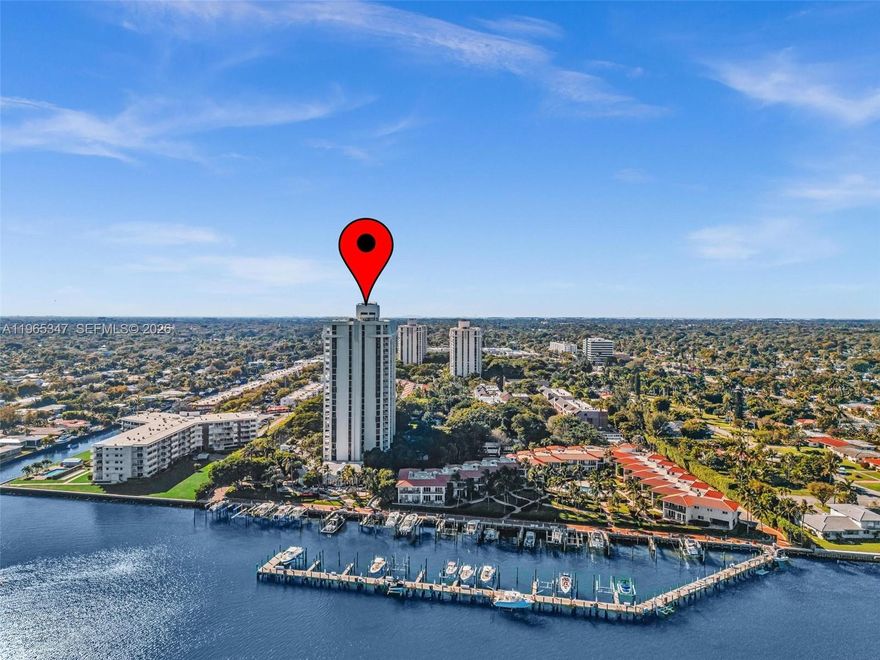 Welcome to resort living in the most coveted Quayside Tower 4. Beautiful tropical 2/2 with sparkling bay views from every room through large impact glass windows that provide safety and serenity. This light filled residence offers an updated kitchen with modern finishes, renovated bathrooms and sleek design throughout. Your truly effortless lifestyle includes a private marina, waterfront promenade, clubhouse with bayfront restaurant and bar, indoor/outdoor heated pools, fitness center, tennis complex, racquetball, basketball, soccer, playground, dog park, 24/7 golf cart service, 24-hour security. Minutes to nearby golf courses, the beaches and airport. Move- in ready!!!