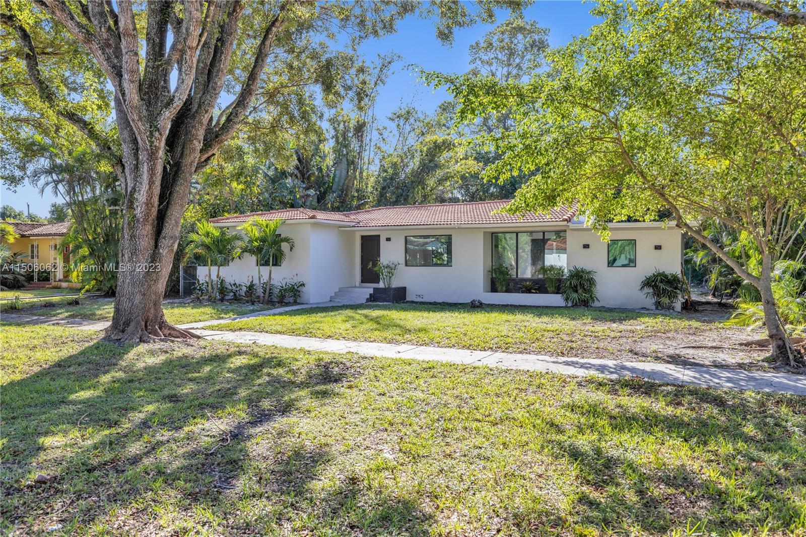 Live in “BRAND NEW” and TOP quality everything! Everything is NEW! From top to bottom, new roof, plumbing, new electric, new kitchen, new bathrooms, new impact windows and doors. Large family room with custom woodwork and porcelain on walls with gorgeous shelving and natural light! Spacious patio perfect for BBQ and entertaining!