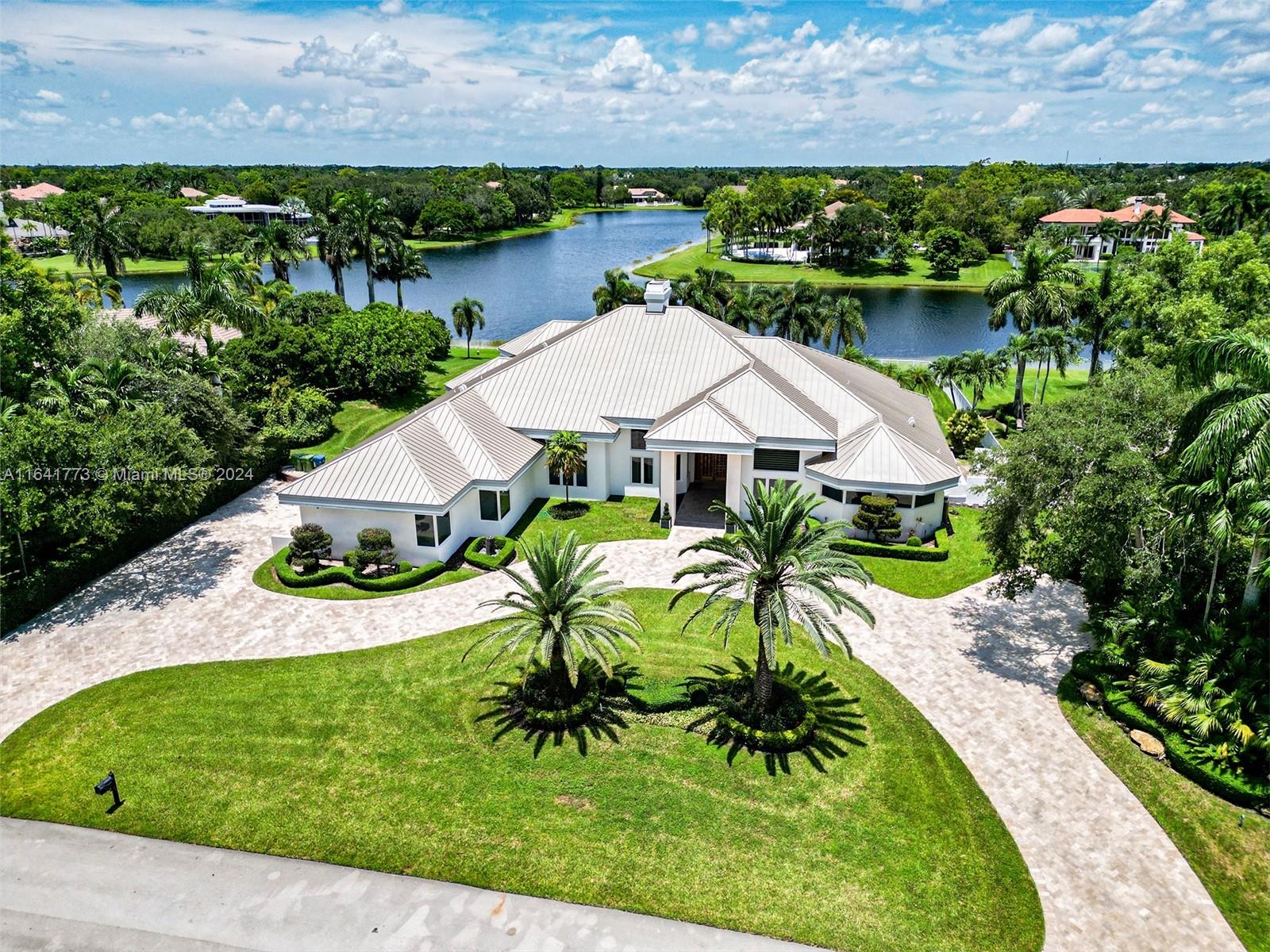 Welcome to this stunning property in the prestigious Windmill Ranch Estates, Weston, Florida.
This gorgeous home features 5 ensuite bedrooms, offering privacy and comfort for every member of the family, plus an additional half bath for your guests. Enjoy working from home in the dedicated office space, and unwind in your own private home theater.
The home boasts impact windows, ensuring safety and energy efficiency, a new roof, and breathtaking lake views that will make every day feel like a getaway. Located in the heart of Weston, you'll have access to some of the best public and private schools in the state, as well as beautiful parks, golf courses, and much more. Don’t miss this opportunity!
