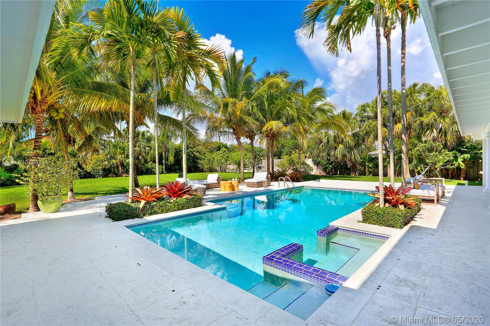 Absolutely beautiful Pinecrest Elementary home with exquisite updates and modern feel. This builder&#x2019;s acre is lush and private with great entertaining spaces, including wood beamed covered patio w/ living & dining spaces and lovely sparkling pool. Some upgrades include gorgeous kitchen w/ top of the line appliances, large island w/ quartzite countertop & cozy breakfast area, newer roof, electrical redone, new Italian porcelain floors, new ACs & ductwork, recessed lighting, surround sound w/ Sonos, all bathrooms redone except one, and high impact windows and doors throughout. This split bedroom plan offers 5 br / 4.5 ba, 2 car gar, laundry rm & much more. This truly is a delight to show!