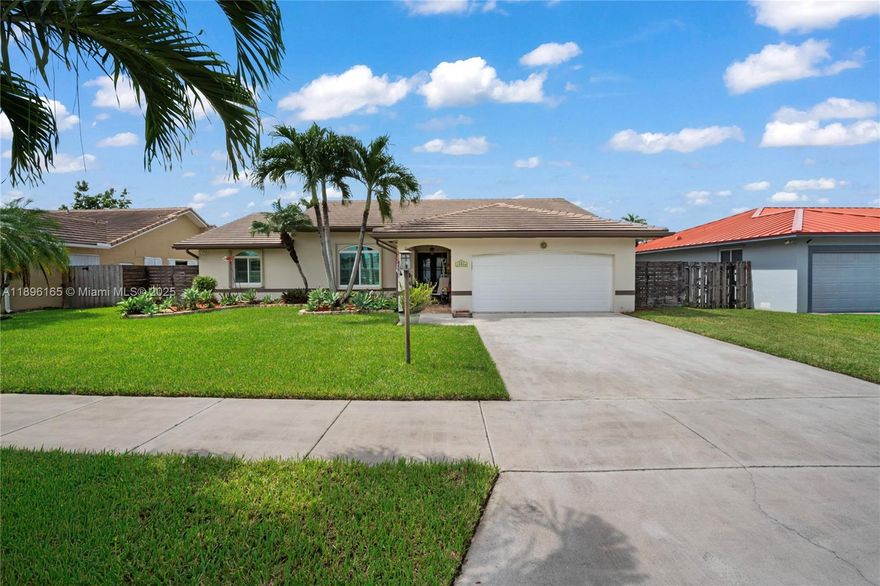 Beautifully maintained 4-bedroom, 2.5-bath home with brand-new tile roof and all impact windows and doors. Original owner, pride of ownership throughout. Features include a custom kitchen with granite countertops, solid wood cabinetry, and rollout drawers. Newly renovated bathroom with rain shower. Whole-house 27,000-watt generator with three 100-gallon propane tanks provides full power backup. Oversized lot with 10' x 12' storage shed and irrigated plant/orchid house. Located in a quiet neighborhood with top-rated schools.