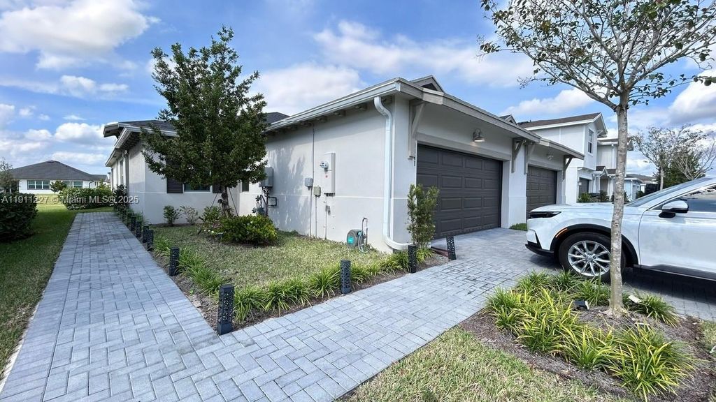 Photo of 1441 Haywagon Trl #1441, Loxahatchee, FL 33470 (MLS # A11911227)