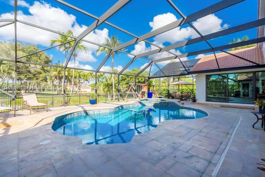 Photo of 343 Coconut Cir, Weston, FL 33326 (MLS # A11992661)