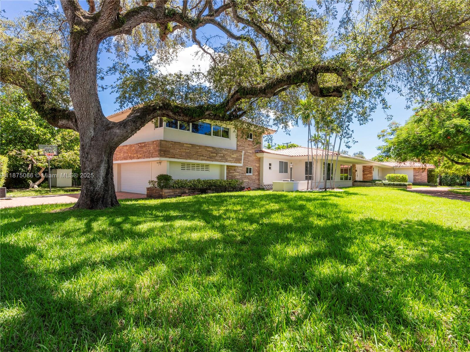 Welcome to your dream home in the heart of Coconut Grove! This stunning 6-bed, 6.5-bath estate sits on a rare 1/2 acre lot in the exclusive Bay Heights neighborhood with 24/7 security patrol. The expansive backyard is a private oasis, featuring a resort-style pool, fruit trees and plenty of room for entertaining. Inside, the home offers exceptional versatility with a private guest suite & a dedicated 2nd floor office. A spacious 2-car garage and ample parking add everyday convenience, while the fully fenced grounds ensure privacy. Conveniently located near Miami's best private schools, Cocowalk, Vizcaya Museum, and more, this property truly has it all—luxury, lifestyle & location. Don’t miss the opportunity to live in one of Coconut Grove’s finest homes! REDUCED to rent quickly.