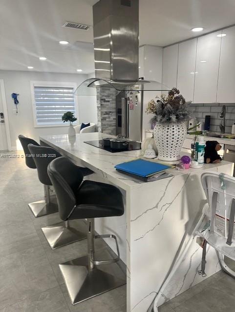 Stunning Remodeled Home Near Doral. This beautifully renovated home offers a fresh, modern feel with everything from the kitchen to the bathrooms and flooring fully upgraded. Featuring 3 spacious bedrooms and 2.5 bathrooms, the home boasts an abundance of closet space for all your storage needs. The brand-new kitchen is equipped with sleek quartz countertops and stainless steel appliances, perfect for any home chef. The large, open floor plan creates an inviting flow throughout the home, ideal for entertaining. Outside, the charming backyard includes a covered patio, providing the perfect setting for family gatherings and relaxation. This home is truly move-in ready and offers a perfect blend of comfort and style.