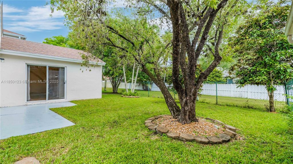Photo of 301 NW 207th Ave, Pembroke Pines, FL 33029 (MLS # A11850123)