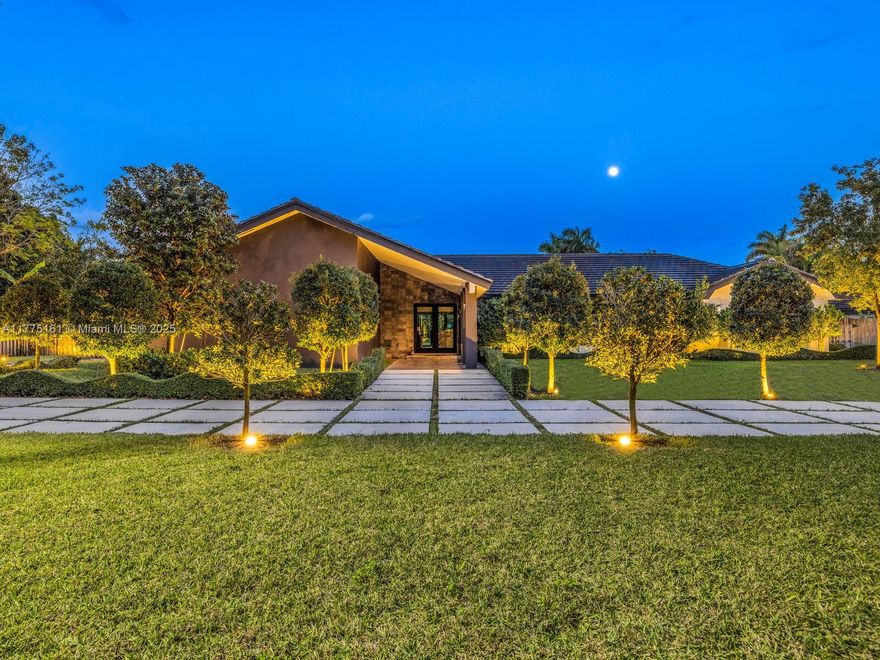 Constructed 2021, 3,537 sq. ft. home gracefully nestled on a sprawling builder's acre within a secure cul-de-sac gated lot. This residence boasts 5 spacious BR/5 elegantly designed BA, adorned with 24x 24 Italian tile that adds a touch of sophistication throughout. The interior impresses with vaulted high ceilings, contemporary bathrooms, and a gourmet kitchen equipped with stainless steel Jenn-Air appliances, with a beautiful stone countertop, perfect for your culinary creations. Enjoy the luxury of an in-home theater and an abundance of natural light streaming through the numerous windows. Step outside to a covered, expansive patio that seamlessly transitions to a 40ft x 20ft saltwater pool surrounded by a travertine deck, ideal for both relaxation and entertaining.