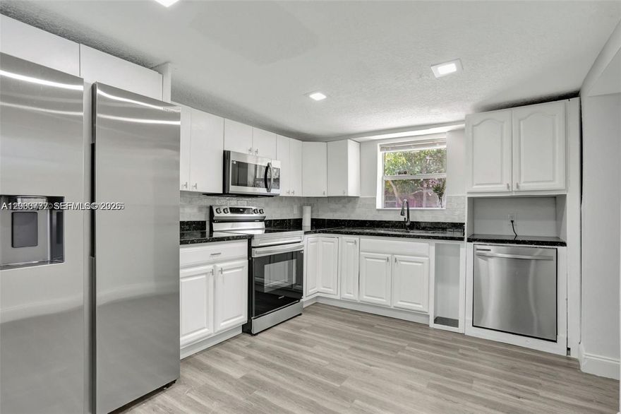 Beautifully renovated home with brand new roof, freshly painted inside and outside, new kitchen with quartz counter tops, backsplash, cabinets, new ss appliances, vinyl waterproof flooring and ceramic tile, new LED lighting in the entire home, AC well maintained, washer and dryer; split floor plan with 3 beds/2 baths, spacious driveway with plenty of space to park and nice size yard. Great location near shopping, restaurants, Downtown Ft Lauderdale & Airport, beaches. Tenant to pay for all utilities and lawn care ($80.00 a month).