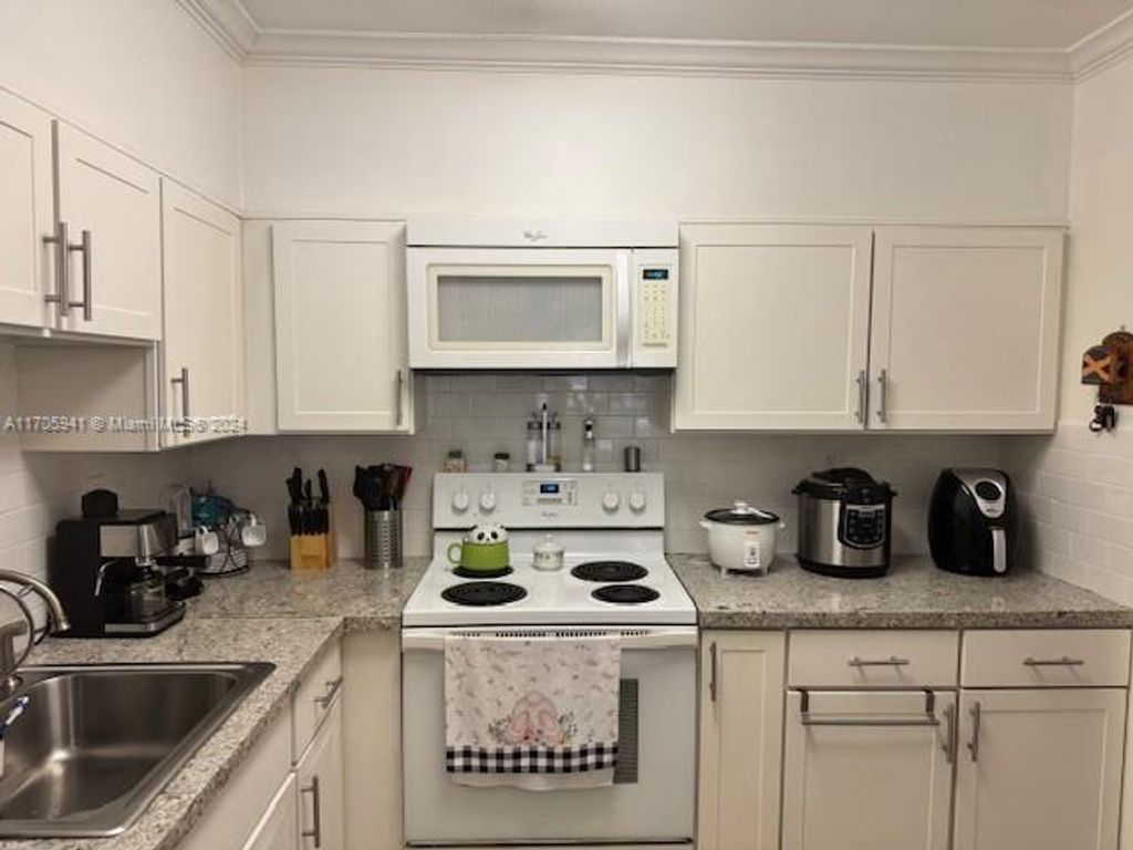 Photo of 4130 NW 88th Ave #207, Coral Springs, FL 33065 (MLS # A11705941)