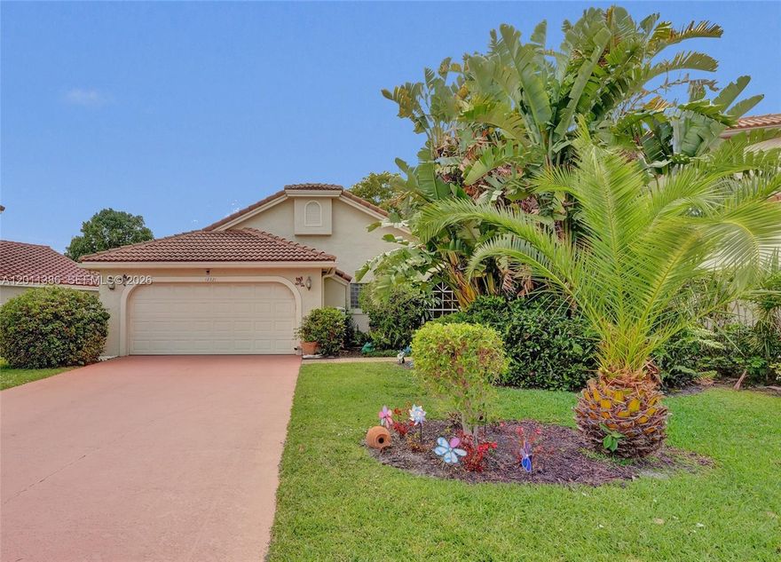 Stunning corner single story ranch residence located in one of Boynton Beach’s most sought-after communities. Located on a fabulous pie shaped lot, this home features soaring vaulted ceilings and tile flooring. The updated kitchen showcases granite islands, stainless appliances, seamlessly combining modern elegance with everyday comfort. The single-story residence offers a spa tub, glass shower, and coordinated high-end vanities. A generous two-car garage and expansive driveway provide ample parking. The oversized yard and double sized enclosed patio offer generous indoor outdoor living space.