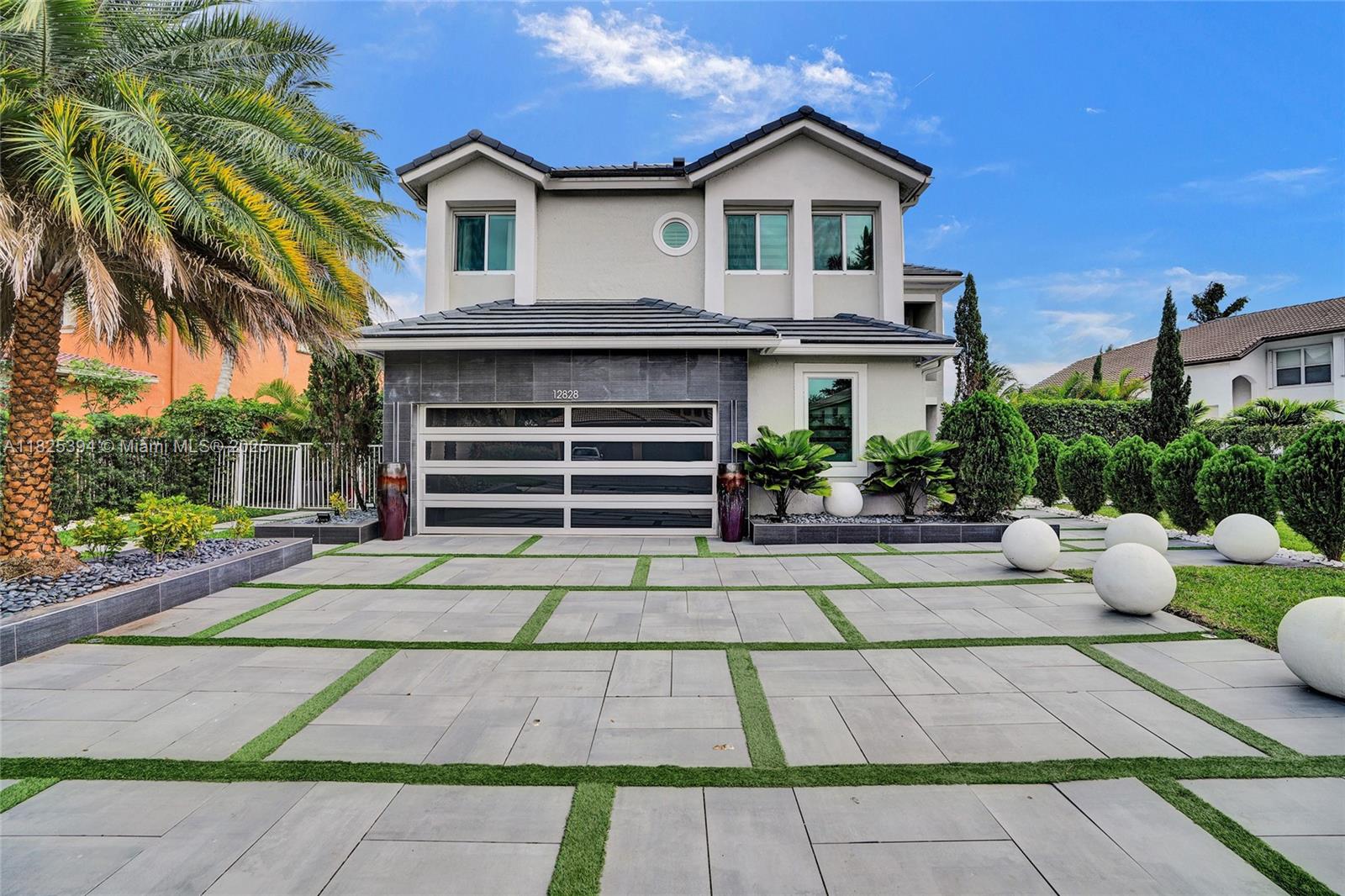 View this stunning & expansive 5-bed, 3-bath home w/ a dedicated office and is one of the largest models in this highly sought-after community, offering over 3,100 sq ft of fully renovated living space. Enjoy the peace of mind that comes with a brand-new roof and hurricane impact windows throughout. The open-concept design features a chef-inspired kitchen with quartz countertops, stainless steel appliances, and abundant cabinetry. The spacious master suite offers a serene retreat with a spa-like bath. Perfect for entertaining, the backyard oasis includes a heated pool and spa, outdoor kitchen, and peaceful lake views. A first-floor bedroom adds convenience and flexibility. Residents also enjoy access to a renovated clubhouse with a weight room and pool. A Home filled w/ Elegance.