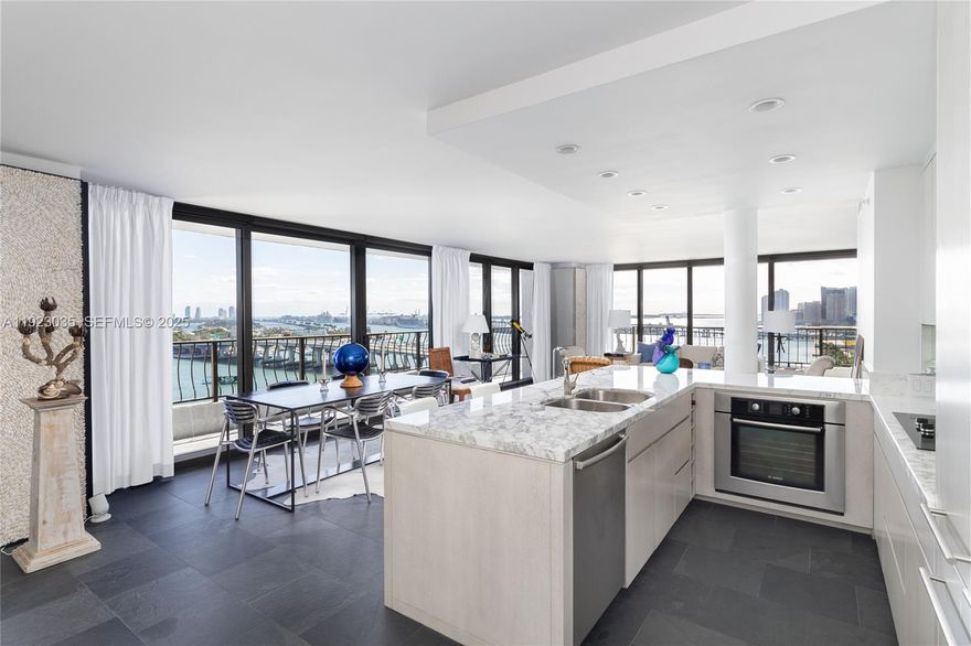 Stunning, fully renovated A-line corner skyloft with spectacular 270° views of Biscayne
Bay, Miami Beach, the Port, and the skyline. This sleek 1280* sq ft 1BR/2BA residence
features floor-to-ceiling impact glass, a sweeping wraparound balcony, and an open,
modern layout that feels bright, private, and effortlessly luxurious. Custom chef’s kitchen
with marble counters, breakfast bar, and luxe cabinetry. Contemporary bathrooms with
bold finishes and spa-like showers. Convertible bedroom, built-in closets, washer/dryer,
and high-end designer touches throughout—truly move-in ready.
Located in Miami’s vibrant Arts & Entertainment District, steps from world-class dining,
the Arsht Center, museums, concerts, Bayfront Park, and the free Metromover.
Brightline nearby connects you to Brickell, Aventura, Boca, and West Palm. The Venetia
has completed its 40-Year Recertification, with lobby and amenity upgrades underway
for 2026. Assigned parking, valet, and an on-site marina offering expanded capacity for
larger vessels. A rare, unobstructed-view corner home in a recertified waterfront
building—ideal as a primary residence, pied-à-terre, or investment with exceptional
long-term upside.