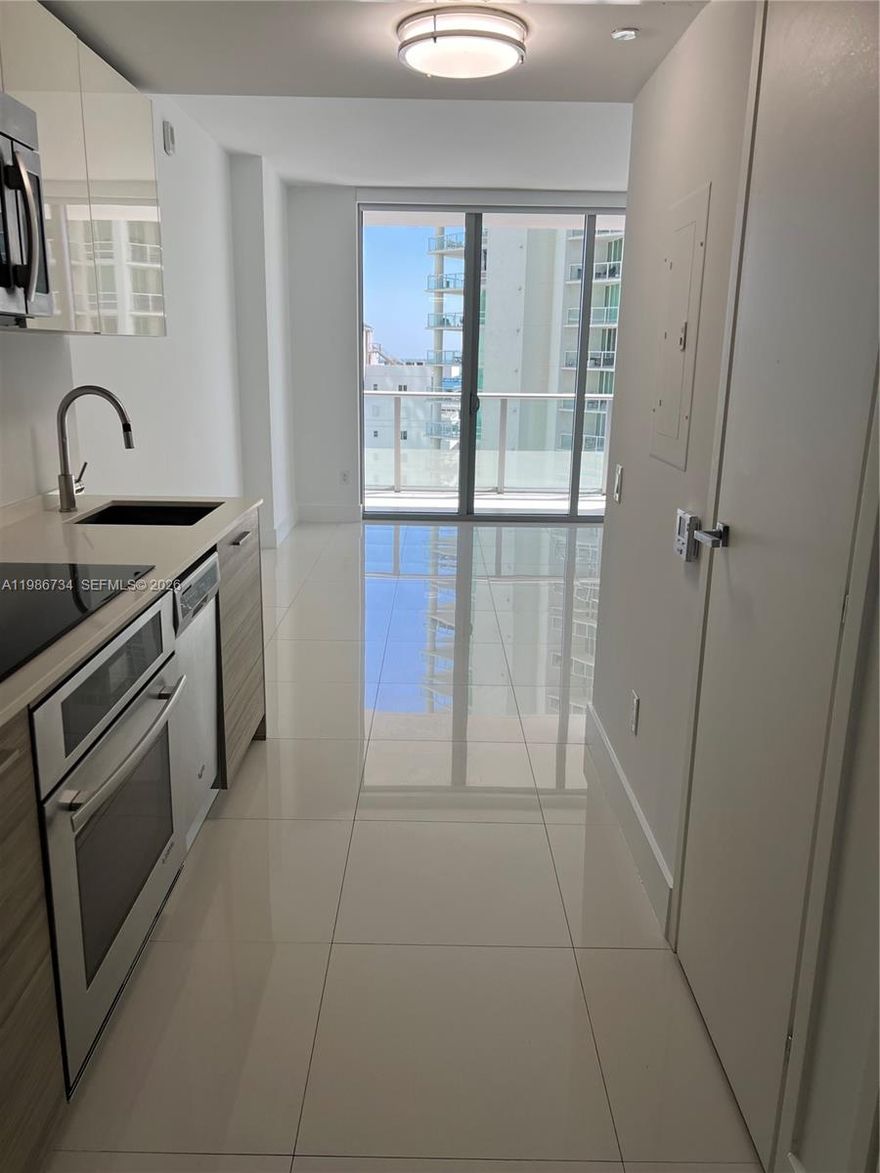 Beautiful studio located in the heart of Brickell, offering the perfect retreat for both investors and end-users. With a flexible short-term rental policy, this property presents an excellent opportunity for income or personal use. The unit is filled with natural light and features an open floor plan with high ceilings and sleek white porcelain floors, creating a bright and airy atmosphere. Step onto your private balcony and enjoy stunning views of Biscayne Bay. Ideally situated just steps from the financial district, trendy dining, and vibrant shopping, this residence combines luxury living with exceptional convenience. This unit includes one assigned "Self-Parking Right" with an additional "Self-Parking Right" that will transfer with the sale.