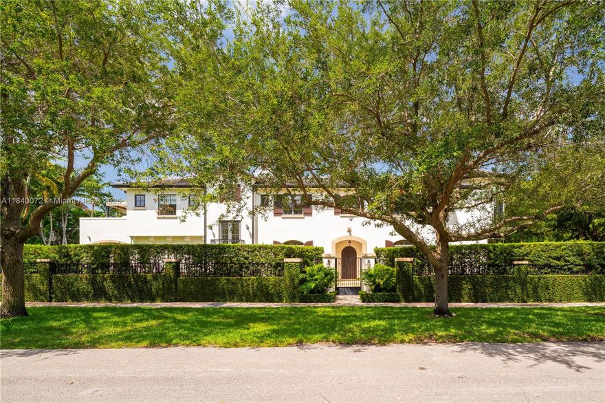 Set on one of South Coral Gables’ most prestigious streets, this 2015 estate embodies modern elegance and effortless living. Spanning over 6,000 sq ft, the thoughtfully designed interiors open seamlessly to lush gardens, breezy terraces, & inviting covered lounges. Awaken to sunlit views, gather in a chef’s kitchen with gas range, or host unforgettable evenings in a summer kitchen made for celebration, all surrounded by lush landscaping. An elevator serves 4 en-suite bedrooms up, including a tranquil primary retreat w/a private terrace, & 2 en-suites down. Impact glass & generator enhance peace of mind. This estate is not in a flood zone. Positioned on a gated 19,000 sq ft corner lot w/a 3-car garage, the stately presence of this home offers an unsurpassed lifestyle. A Very Special Home.