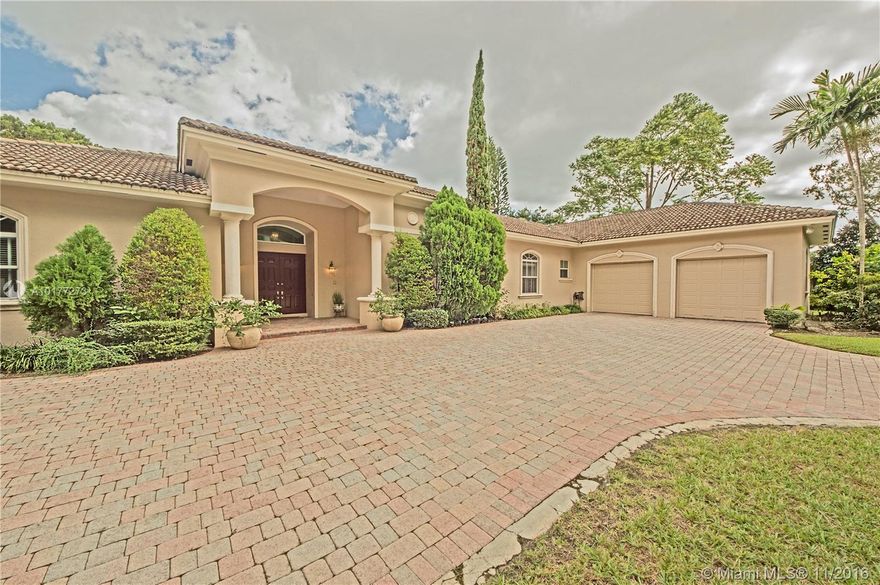 This impressive Hollub built home is waiting for you. Privately walled & gated one owner home w/quality throughout. Volume & tray ceilings, crown moldings, almost all doors & windows are impact, whole house generator, 2 new a/c units & water heaters. Formal living room, huge dining room. Large, beautifully equipped kitchen opening to family room overlooking lushly landscaped yard w/newly surfaced pool.Split bedrooms 2 and 2 huge laundry & storage/mud room. Walking distance to Coral Reef park & schools.