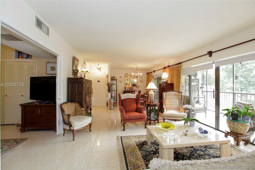 1ST FLOOR CORNER updated UNIT 3BD/2BA. LARGE KITCHEN, TILED, WOOD FLOORS, LARGE BALCONY. NEW WINDOWS, ACCORDION SHUTTERS, Granite countertop kitchen, tankless water heater, new A/C unit. 2 ASSIGNED PARKING SPACES, STORAGE, SECURED BUILDING WITH GATED ENTRY, PRIVATE BUILDING OWNERS ONLY NO RENTALS ALLOWED. UNIT HAS PICTURESQUE GARDEN & GOLF VIEWS. CLUBHOUSE FACILITIES; LAKE, POOL, PARTY ROOM, SAUNA, GYM, TENNIS COURTS, TIKI HUT & OUTDOOR BBQ GRILL. RUNNERS ENJOY MORE THAN 4 MILES OF BIKING, PLAYING & RUNNING TRAILS. RESTAURANTS GREAT LOCATION...