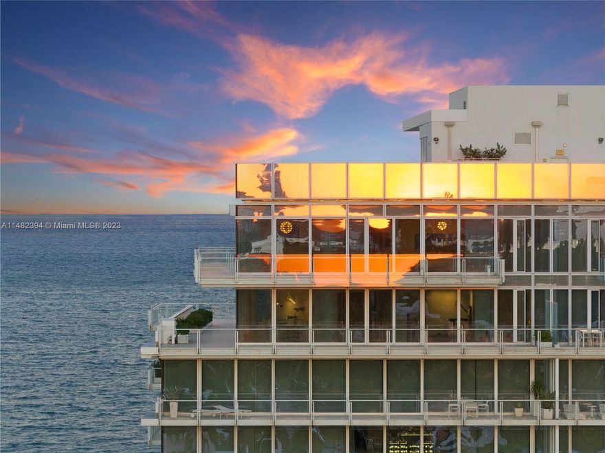 The vast blue horizons of the Atlantic Ocean are the backdrop to The Surf Club Penthouse. Spanning 7,000+ Int SF across 3 levels seamlessly blurs indoor/outdoor living with floor-to-ceiling glass walls, filling the interior with natural light. A culinary haven, the kitchen is equipped with Boffi cabinetry, Miele, Viking & SubZero appliances & abundant storage. In the primary suite, pure elegance awaits. Its sleek bathroom is adorned with white onyx, free-standing tub & oversized shower. Countless features set this residence apart including a 75' rooftop pool, yoga room, gym, spa, outdoor garden, private garage parking & oceanfront cabana. Designed by renowned architect Richard Meier, the Four Seasons Residences offers access to all the five star services & amenities the resort has to offer