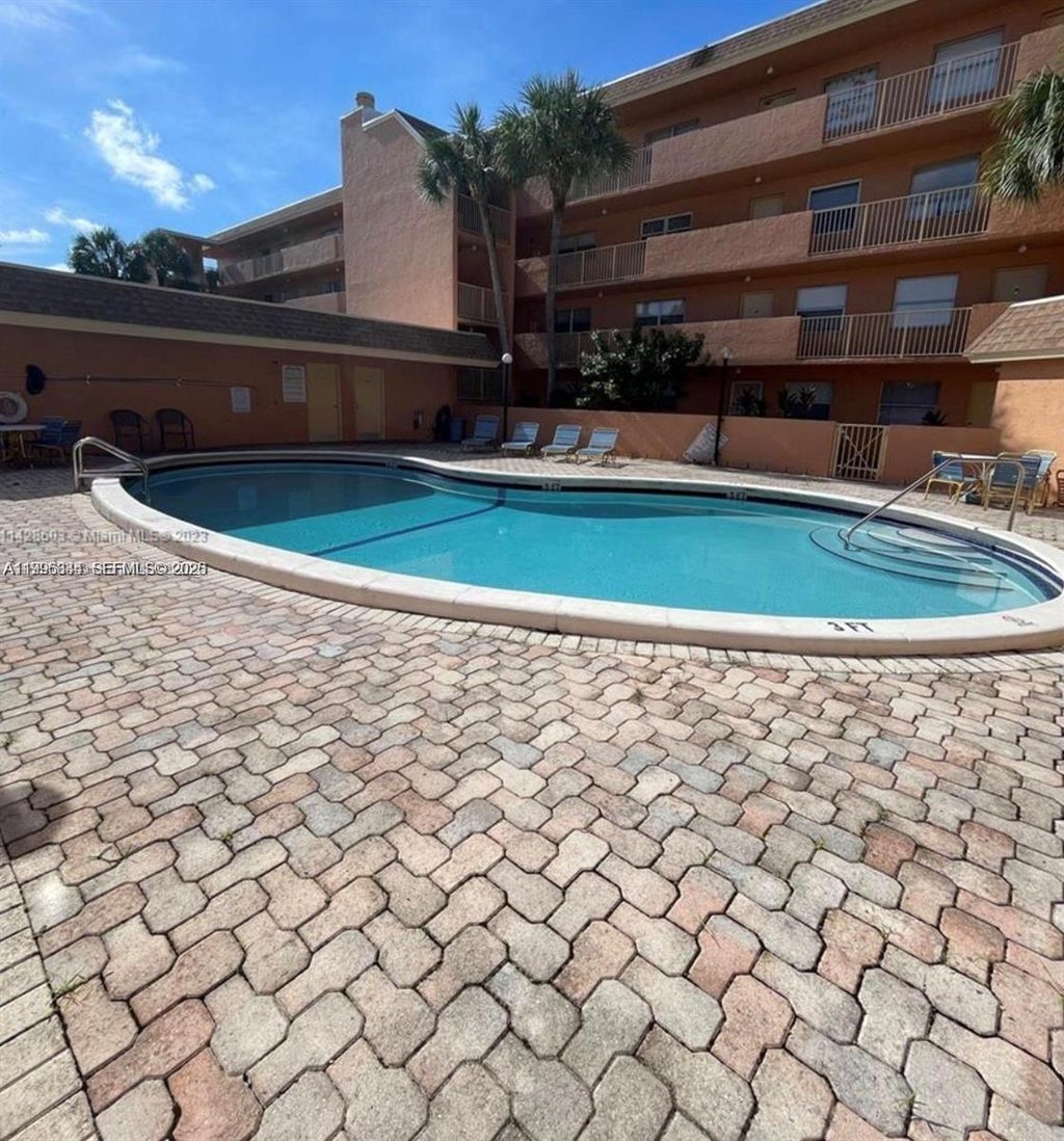 Photo of 3100 N Pine Island Rd #103, Sunrise, FL 33351 (MLS # A11996334)