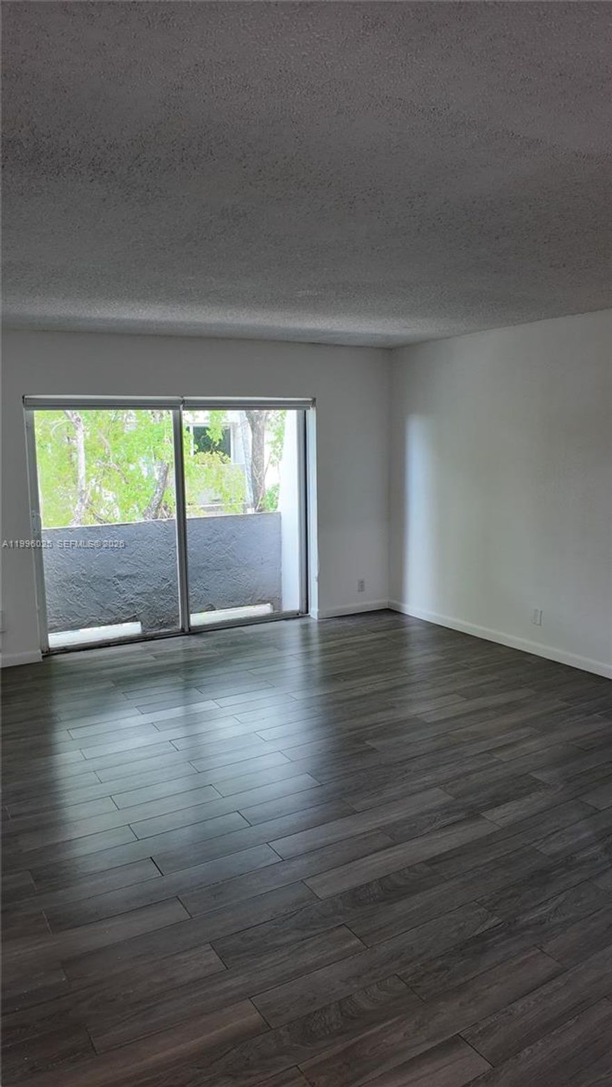 Beautiful and well-maintained 3-bedroom, 2-bathroom corner unit located in a secure gated community. This spacious apartment features a private balcony and has been freshly painted, offering a bright and inviting living space. Rent includes water and high-speed Internet/Wi-Fi for added convenience. The community offers excellent amenities, including a pool, on-site laundry facilities, and three unassigned parking permits. Ideally situated near Florida Turnpike Exits 12 and 13, providing easy access to major highways, shopping, and dining. One of the best-priced 3-bedroom units in the area with a fast and easy approval process. The listed price reflects a promotional rent credit equivalent to one month free, prorated over a 12-month lease. Original rent is $2,465.