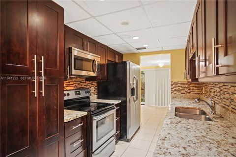 Photo of 8011 NW 27th Pl, Sunrise, FL 33322 (MLS # A11941228)