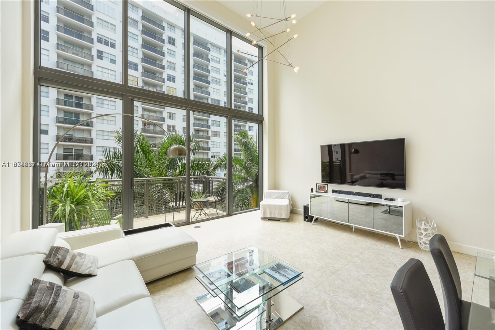 Experience the Miami Beach townhouse lifestyle! Nestled in the highly sought-after Terra Beachside Villas, this three level 3-bed 3-bath boasts 19 Ft voluminous ceilings, a desirable 1300 SF private rooftop with a grill, direct beach access and modern finishes. It also features generous floor-to-ceiling windows and balconies throughout welcoming natural light & quintessential Miami Beach relaxation. The kitchen boasts quality cabinetry, top appliances, stainless steel & quartz countertops. The primary bedroom features a marble bathroom w/ a large double shower, double sinks, a bidet. Amenities include a stunning elongated lap pool, jacuzzi a gym and community room. Unit comes w/ Two assigned garaged parking spaces. Don't miss out on the opportunity to make this distinct property your own!