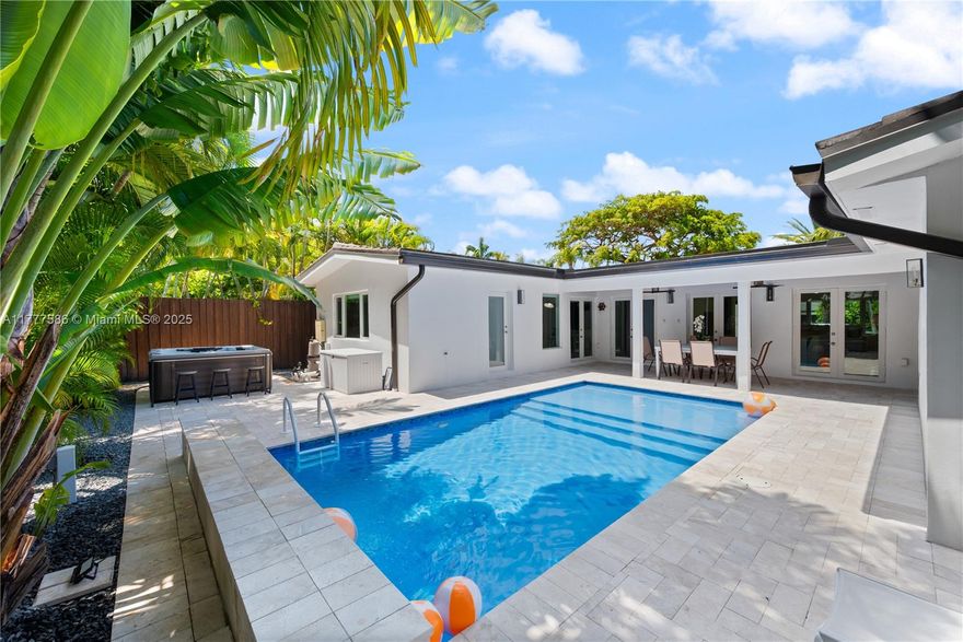 Mid-Century Modern home in guard-gated Morningside! Nestled on a spacious 8,085 SF lot, this 4BD/4BA residence offers an open floor plan with expansive living & dining areas, a chef’s gas kitchen with newer appliances, family room, ample storage, garage & newer roof. Enjoy abundant natural light, recessed LED lighting & a private backyard with a heated saltwater pool, hot tub, new summer kitchen, covered patio & lush landscaping. The front yard is framed by graceful date palms & an expansive circular driveway with ample parking. Only three homes from Morningside Park, a serene 40+ acre waterfront park with tennis, football fields, walking trails, boat ramp & kayak rentals. NO HOA! Close to top schools: Cushman School, Miami Country Day, & JLA.