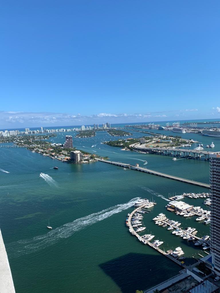 Gorgeous 3 Bed/3.5 bath apartments in state of the art condo Aria on the Bay. Enjoy the breathtaking Bay/Ocean view from this 47th level 50foot long terrace. Private Elevator/Foyer, floor-to-ceiling glass, Bosch kitchen appliances, European cabinetry, Quartz countertops, custom walk-in closets. 2 PARKING SPACES (very rare in this building). Resort style amenities include 2 heated pools, hot tub, BBQ, spa, sauna, steam room, lounge/party room, business center, fitness center, yoga studio, movie theater, kid's area and more.