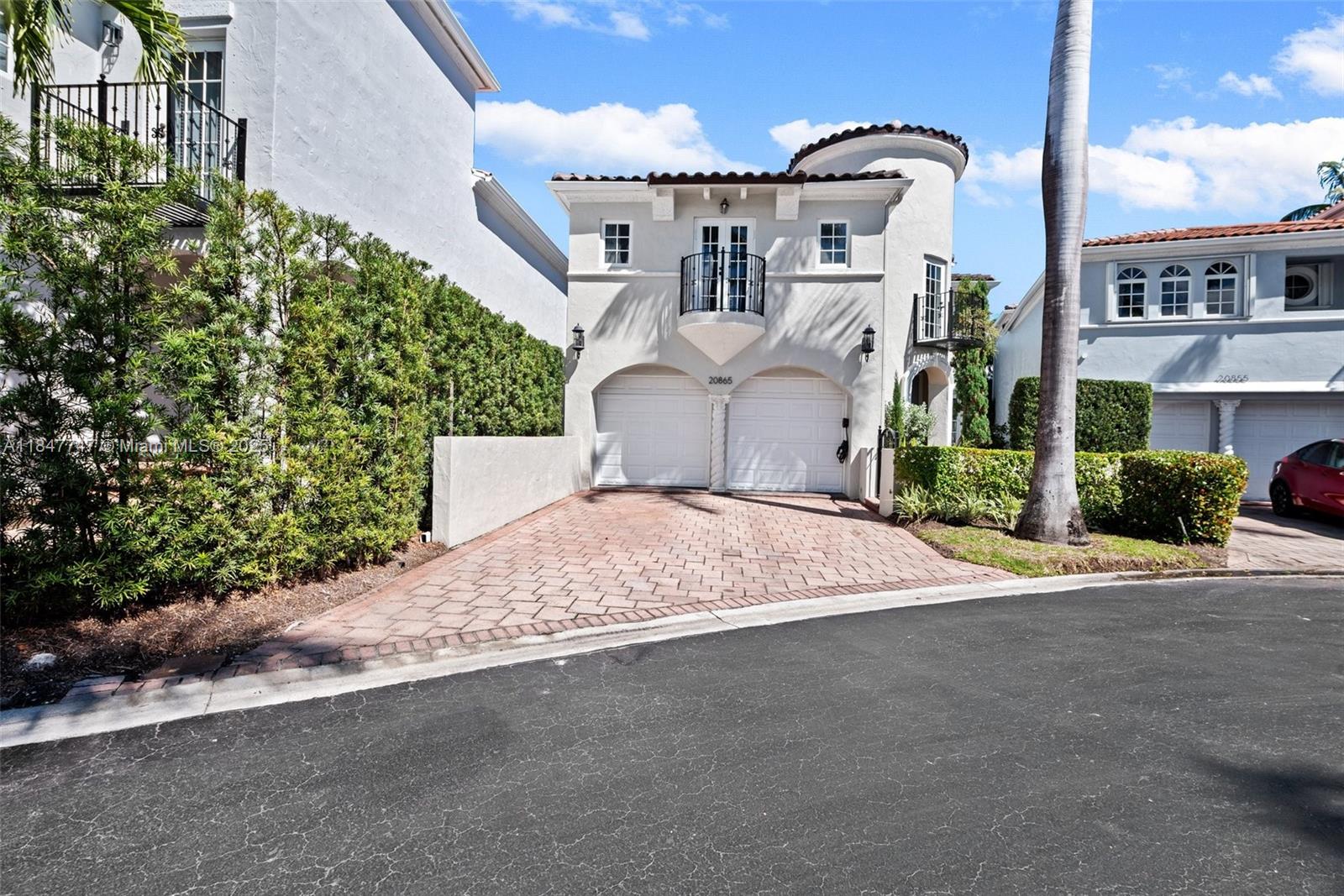 Renovated waterfront home in gated Aventura Lakes with 4 bedrooms and 4.5 baths. Features high ceilings, tile floors, and a modern layout. Kitchen with quartz countertops, sleek cabinetry, and stainless steel appliances. Each bedroom has an en-suite bath with contemporary fixtures. Primary suite includes walk-in closet and frameless glass double shower. New roof, full-house water filtration, Mohen water system, recessed lighting, updated heater. Private backyard with lake views in a quiet cul-de-sac. Community offers 24/7 security, 2 pools, Jacuzzi, clubhouse, fitness center, playground, game room, on-site management, lush landscaping, and is near Aventura Mall, beaches, A-rated schools, dining, Gulfstream Park, and golf courses.