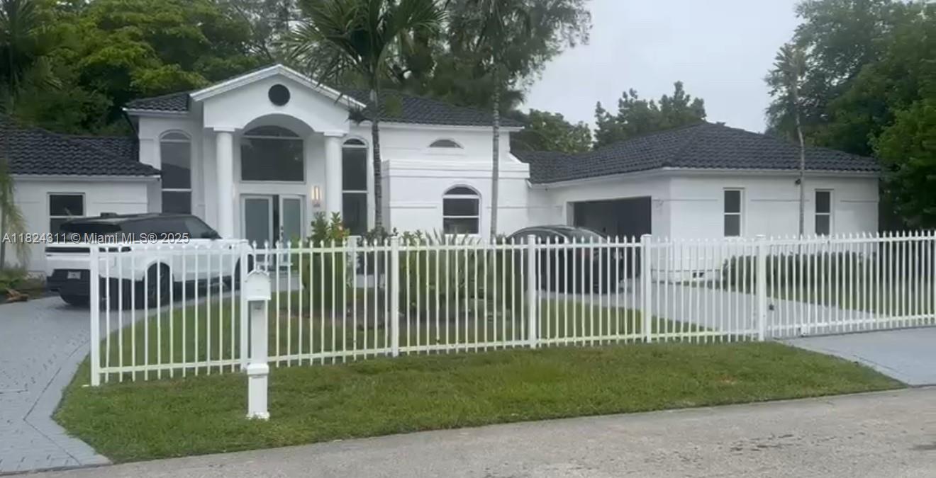 Modern, completely remodeled, elegant and spacious 6 Bedroom, 3 Bathroom mansion. Cul de sac street. Impact windows throughout. White porcelain flooring throughout. 14' high ceilings. New kitchen and bathrooms. New appliances. New glass shower enclosures in all bathrooms. White quartz counters and backsplashes. Motorized gated entry. Covered porcelain tiled patios. Adjacent to Old Cutler road, across from bay (second house from the Florida Bay). Cool bay breezes. Excellent schools and houses of worship.