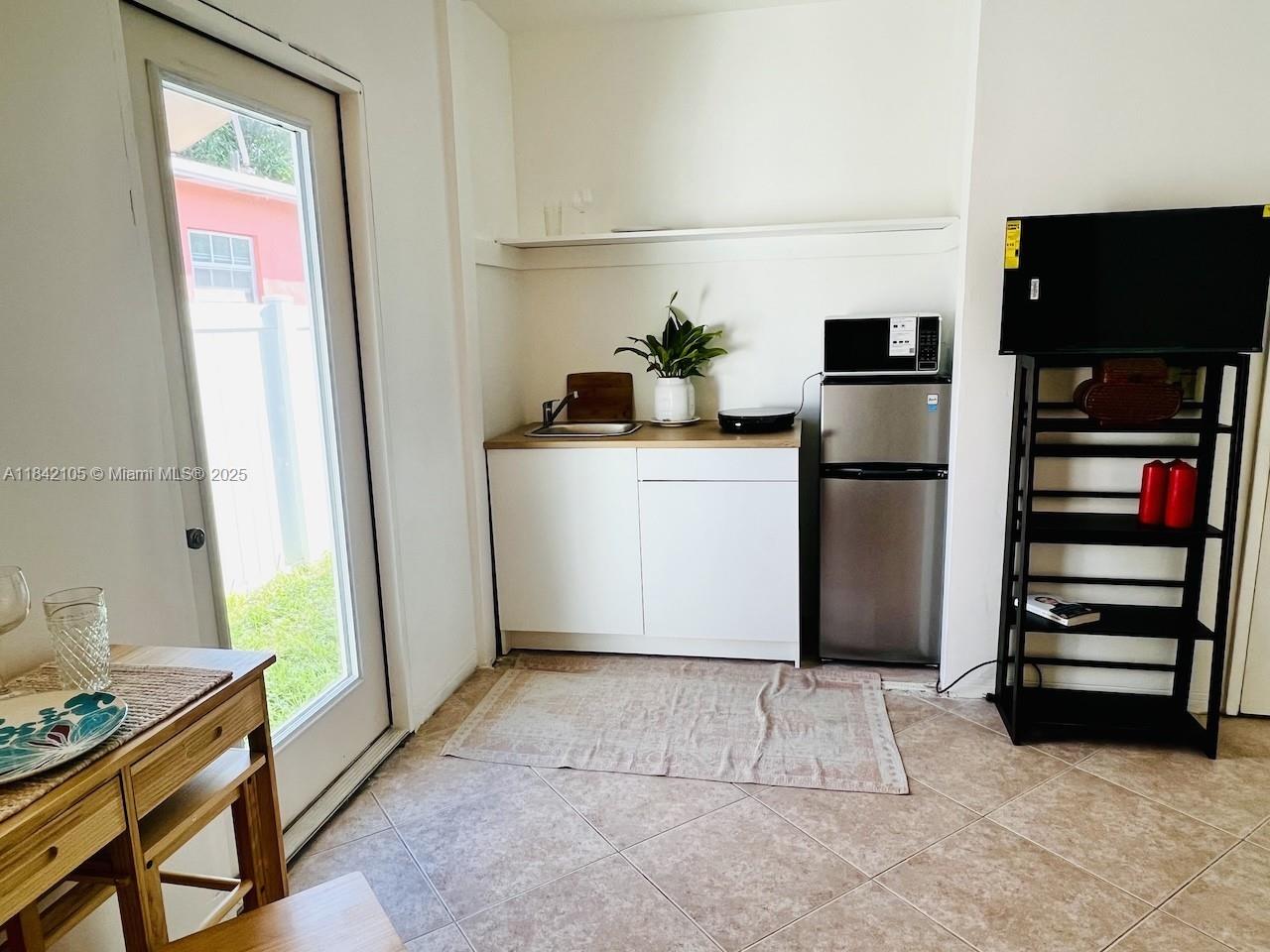 Efficiency with private entrance and private bathroom in a single-family home in a prime North Miami location, and by Biscayne Park. OCCUPANCY IS FOR ONE PERSON ONLY! Partially furnished. Minimum 6 months lease. Must be a US resident: credit score 650+ and proof of income. The minimum income-to-ratio must be 2 1/2 times ($3,250) the rent. Easy to show. Approval within hours. Rent includes electricity, wifi, water, and trash. New compact refrigerator, new microwave, and new cooking burner. High-impact door and window. Plenty of street parking. NO PETS, NO SMOKERS. Central AC. No Washer/dryer.Short drive from Whole Foods, Publix, and Aldi supermarkets and shopping centers. About 30 minutes from Aventura and South Beach, and close to Bal Harbor and the beach.
